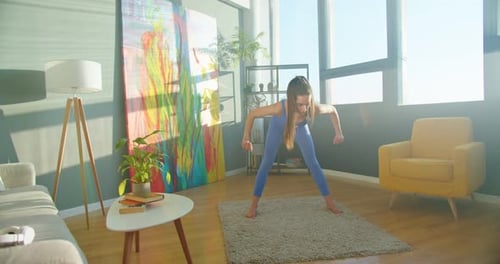 Woman Exercising and Stretching at Home