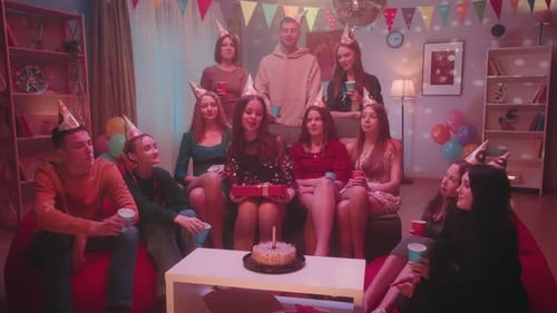 Friends Celebrate Birthday Party with Cake and Sparkler