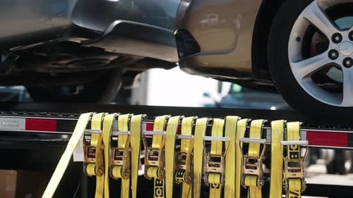 Cars Securely Strapped to an Auto Transport Trailer