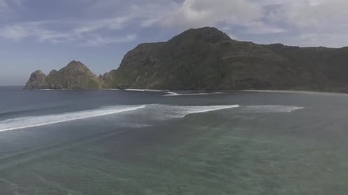 Aerial View of Ocean Waves and Coastline