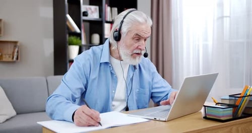 Senior Man Working on Laptop at Home