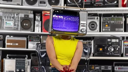 Woman with TV Head Dancing in Front of Radios