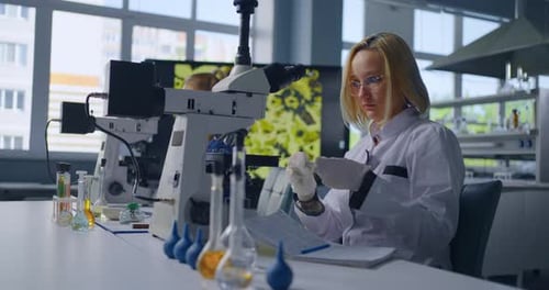 Young Woman Scientist Working in a Laboratory