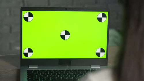 The Girl Works with Chroma Key on Her Laptop Remote Work Using a Computer Green Screen Concept