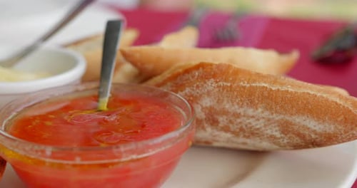 Close up shot of typical appetizer pan con tomate consisting tomato sauce and bread in Spain been se