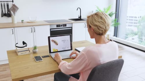 Online Food Ordering with Pizza Displayed on Laptop Screen