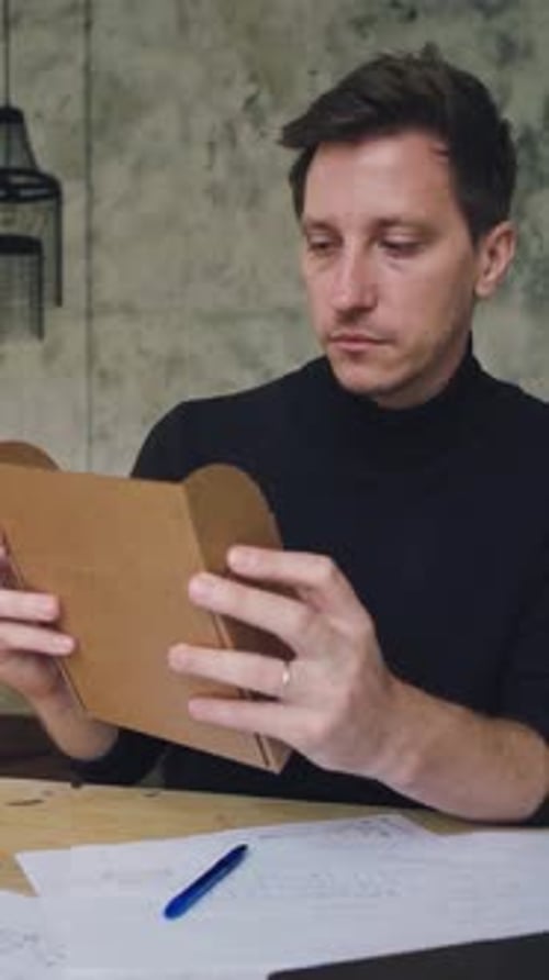 The Designer is Working He is Thinking About a New Packaging Design Young Attractive Caucasian Male