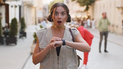 Young Woman Shocked by Smartwatch on City Street