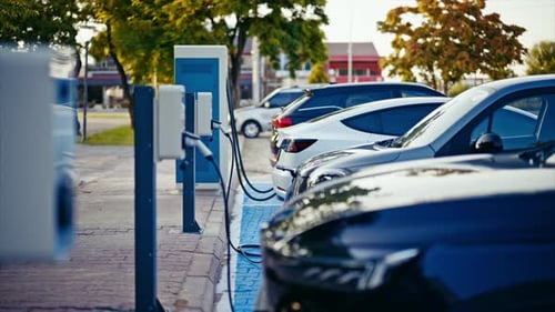 Electric cars charging at a modern charging station