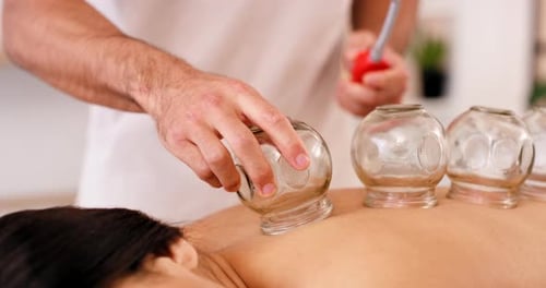 Spa, glass and cupping therapy for back pain, healing and relax body and back muscle with physical