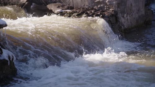 50 FPS Strong Current Falls from Cascade Waterfall in a River on a Bright Day