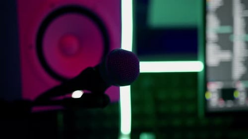 professional recording studio song recording equipment microphone close-up bottom view neon light