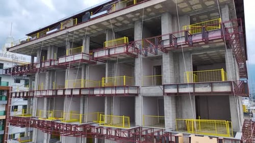 Aerial Video of a Luxury Residential Complex on the Coast Under Construction With Facade and Roofing