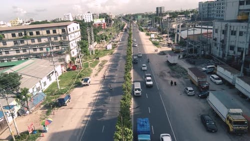 Aerial shot of a busy road where vehicles are passing in Dhaka, Bangladesh,