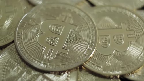 Pile of Silver Bitcoin Coins Close Up