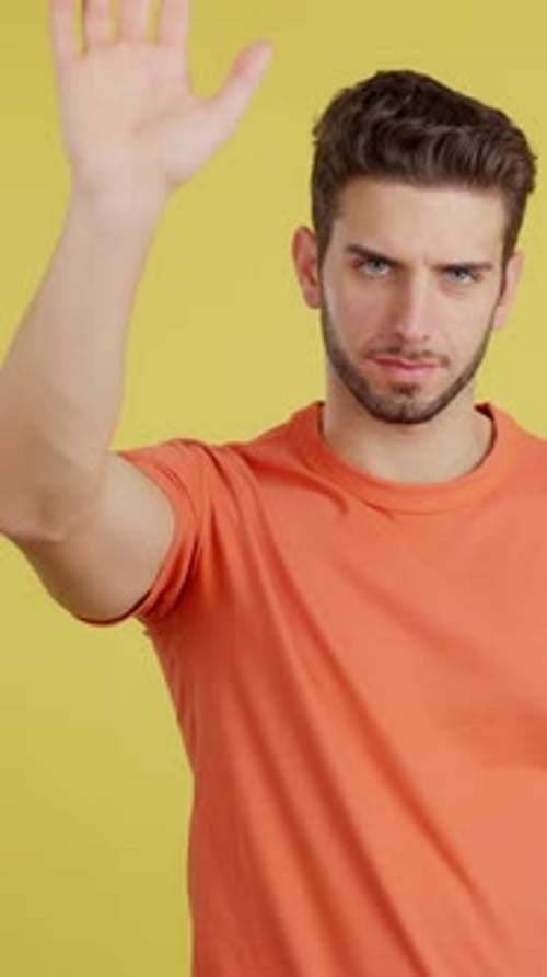 Caucasian Man Gesturing Prohibition with Hand