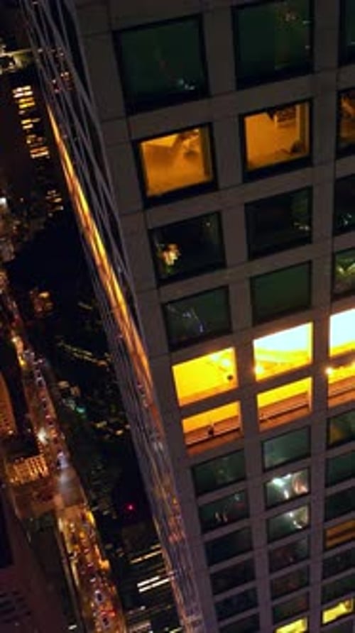 Flying high around the skyscraper at night. Stunning scenery of amazing New York