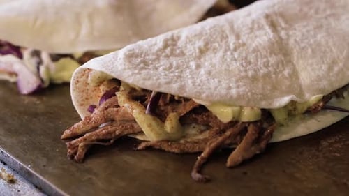 Close up of Delicious Tacos on Wooden Surface