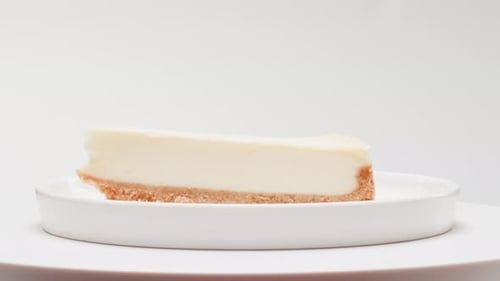 Creamy Cheesecake Slice on White Plate
