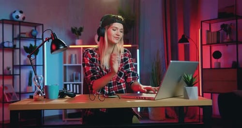 Woman Listening Music, Working at Laptop at Home