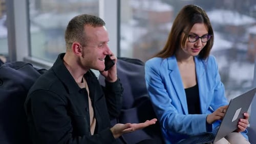 Business Colleagues Working on Laptop Together
