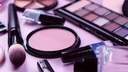 Rotating Background with Decorative Cosmetics Blush Concealer Powder Shadows Nail Polish Makeup