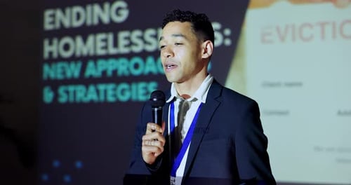 Young Adult Speaking at a Corporate Conference