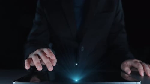 Man Using a Tablet With Digital Circuit Overlay