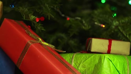 Presents Under Christmas Tree with Festive Lights