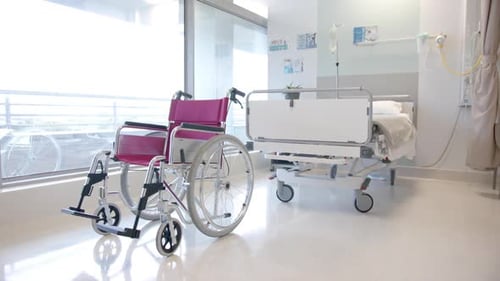 Close up of wheelchair in sunny hospital room, slow motion