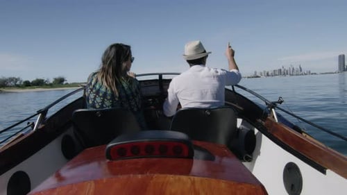 Couple Enjoying Boat Ride on Sunny Day