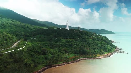 Lady buddha statue standing prominently on son tra peninsula mountain,