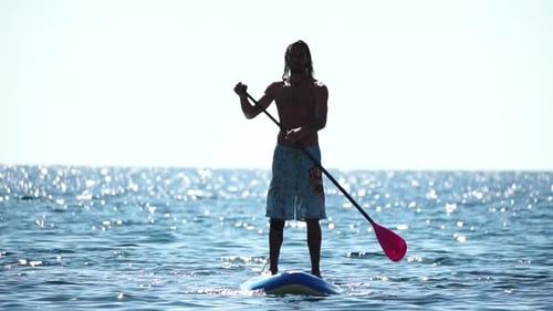 Man Sup Sea Strong Athletic Man Learns to Paddle Sup Standing on Board in Open Sea Ocean on Sunny