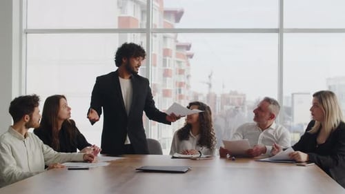 A Group of People in Business Suits Applaud During a Meeting in the Office A Friendly Team of