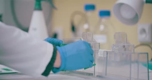 Scientist Prepares Medical Equipment in Lab Setting