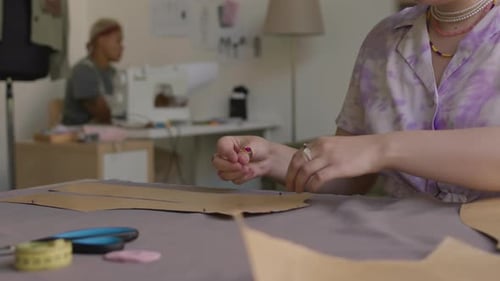 Fashion Designer Making Pattern in Workshop
