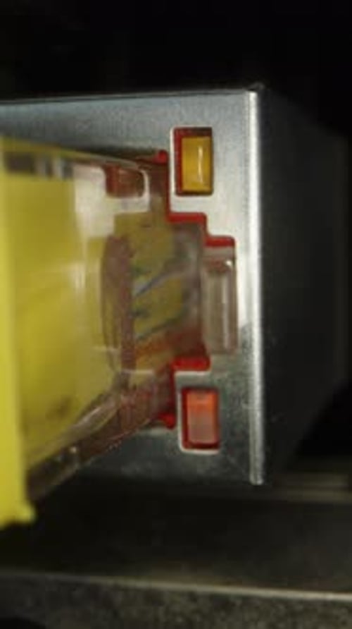 Vertical video. Wired internet connection of a computer, Ethernet port with blinking lights.