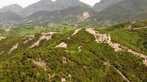 Country landscape with mountains and green hills covered in lush vegetation and trees forest