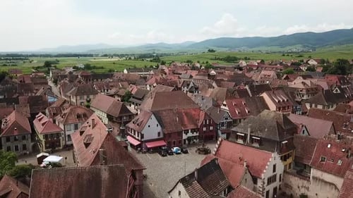 An onward footage moving across the village. This shot reveals the roads around the village and the
