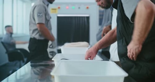 Airport Security Checkpoint with Travelers and Officers