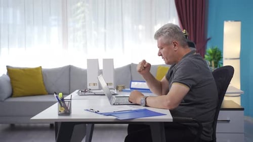 Home office worker man succeeding.