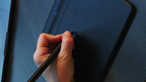 Close up of graphic digital tablet with stylus pen. Vertical video