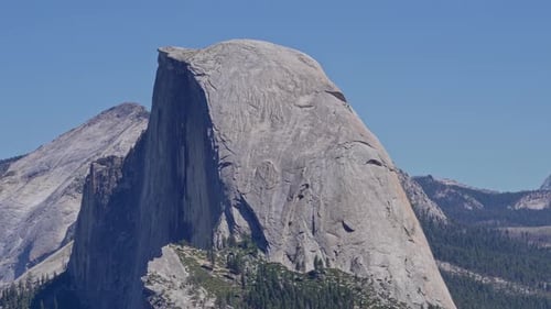 Scenic Close-Up of Half Dome Granite Mountain with Camera Pullback