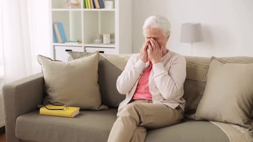 Senior Woman with Eyesight Issues Rubbing her Eyes