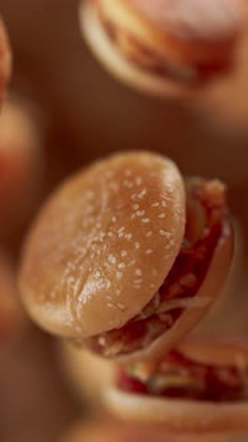 Animation of a group of burgers. Defocus. Close-up.