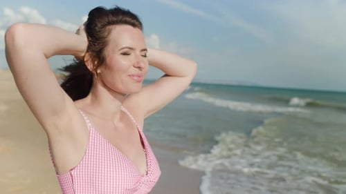 Woman Posing on Beach on a Sunny Day