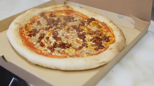 Close Up of Tasty Pizza in Delivery Box