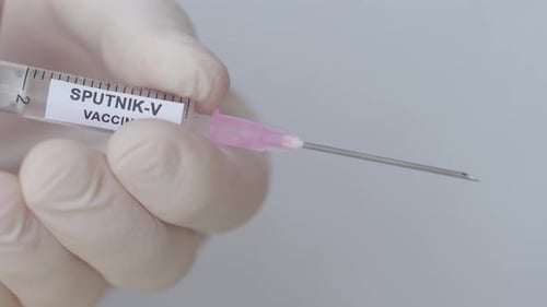 New Vaccine Sputnik - V Holding By A Medical Practitioner During Corona Virus Pandemic, Close Up Sho