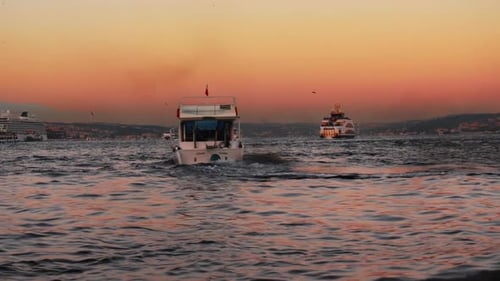 Boats Sailing on Water at Golden Hour