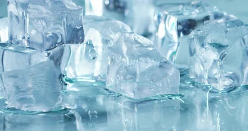 Melting Ice Cubes on Reflective Surface